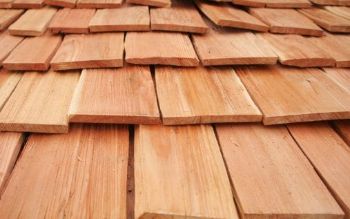 Wood styled shingles installed like wood shakes on a existing shingles